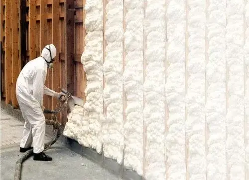 Spray foam insulation being applied to a wall cavity in Midland, TX